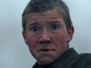 Flyora (Alexei Kravchenko) sinks deeper into madness as he witnesses horror after horror in Elem Klimov's Come and See (1985)
