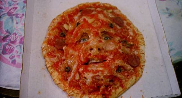 An aggressive pizza threatens the inhabitants of Lewis Abernathy's House IV: The Repossession (1991)
