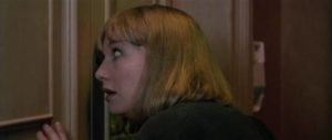 Betty's agent Mira (Daria Nicolodi) makes the mistake of looking through the door's spyhole in Dario Argento's Opera (1987)