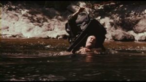 A dangerous river complicates the threat from a human adversary in Peter Carter's Rituals (1976)