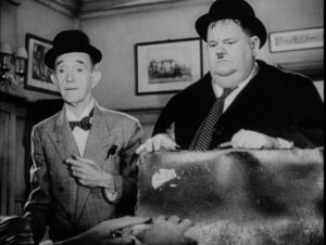 Stan and Ollie receive bad news at the lawyer's office in Leo Joannon's Atoll K (1951)
