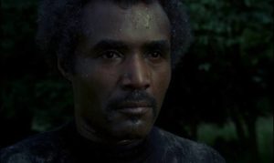 Calvin Lockhart as big game hunter Tom Newcliffe aims to bag a werewolf in Paul Annett's The Beast Must Die (1974)