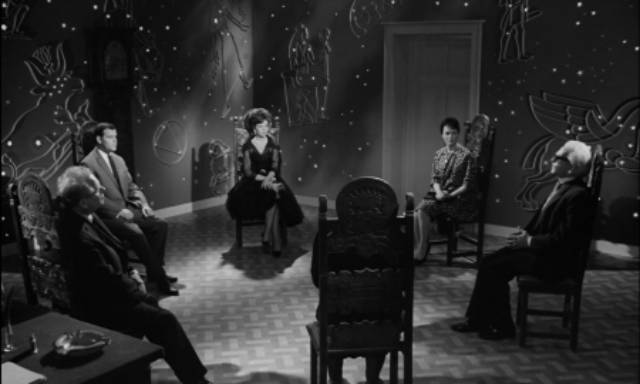 Seer Peter Cornelius (Wolfgang Preiss) conducts a seance in Fritz Lang's The Thousand Eyes of Dr. Mabuse (1960)