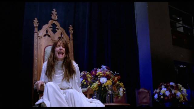 Medium Martha Travis (Rosanna Arquette) is terrified by her own visions in Mike Hodges' Black Rainbow (1989)