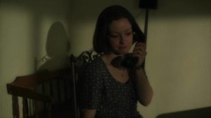 Lois (Jodi Lynn Thomas) begins to understand how dangerous Art (Josh Phillips) is in Pete Schuermann's The Creep Behind the Camera (2014)