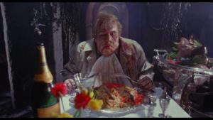 Obnoxious press photographer Peck (Timothy Spall) becomes the embodiment of gluttony in Harley Cokeliss' Dream Demon (1988)