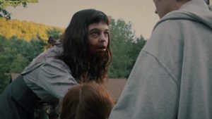 The Woman (Pollyanna McIntosh) offers Chris Cleek (Sean Bridgers)' daughters an unexpected form of liberation in Lucky McKee's The Woman (2011)