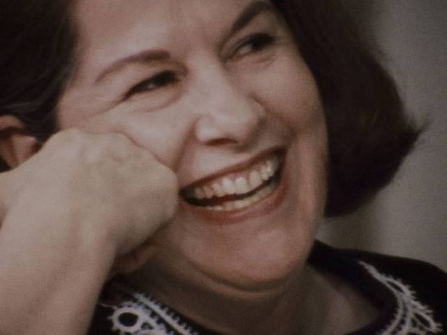 Head of the New York chapter of NOW, Jacqueline Cebellos is amused in Chris Hegedus and D.A. Pennebaker's Town Bloody Hall (1979)