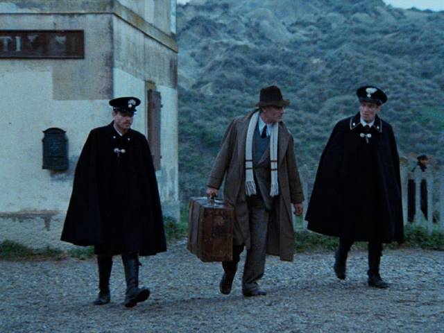 Painter Carlo Levi is escorted by police to exile in a remote village in Francesco Rosi's Christ Stopped at Eboli (1979)