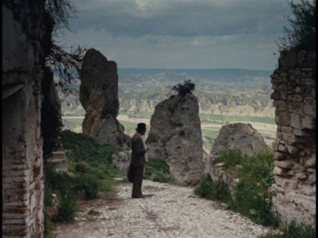 Carlo Levi (Gian Maria Volontè) pauses, waiting for his dog Barone to catch up with him in Francesco Rosi's Christ Stopped at Eboli (1979)