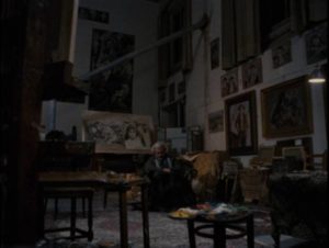 An older Carlo Levi (Gian Maria Volontè) sits among the paintings he made during his exile, remembering the people he lived among in Francesco Rosi's Christ Stopped at Eboli (1979)