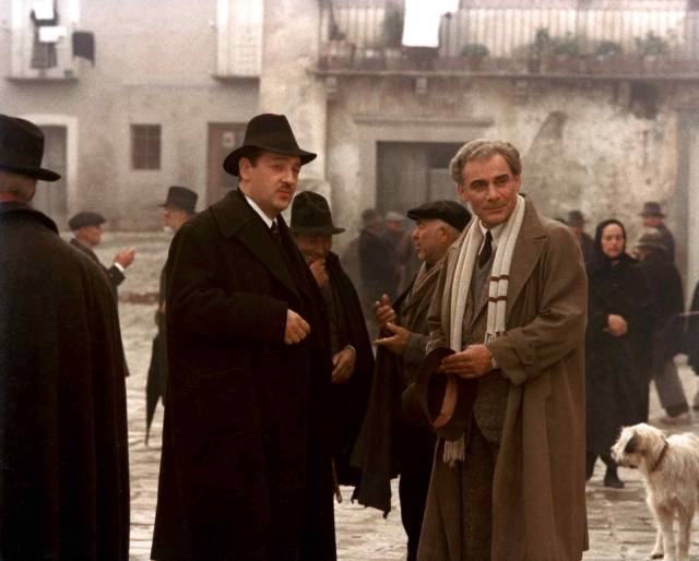 Carlo Levi (Gian Maria Volontè) greeted by the Fascist mayor (Paolo Bonacelli) in Francesco Rosi's Christ Stopped at Eboli (1979)