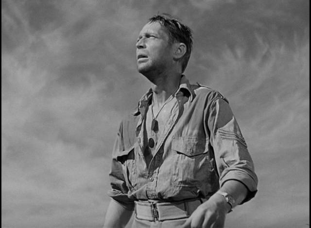 Corporal John Bramble (Franchot Tone) stranded in the desert after a battle in Billy Wilder's Five Graves to Cairo (1943)