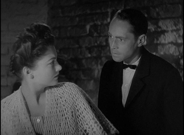 Mouche (Anne Baxter) is reluctant to help Cpl. John Bramble (Franchot Tone) in Billy Wilder's Five Graves to Cairo (1943)