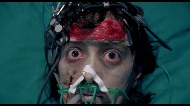 Kathy (Milijana Zirojevic) wreaks havoc from a coma in Lucio Fulci's Aenigma (1987)