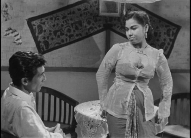 Prostitute Laila (Dhalia) believes Iskandar (A.N. Alcaff) represents a better life in Usmar Ismail's After the Curfew (1954)