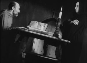 The Prior (Beltran De Heredia) enlists Juan (Victor Urruchua) to exorcise a troubled monk in Juan Bustillo Oro's Dos Monjes (1934)