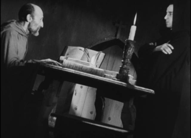 The Prior (Beltran De Heredia) enlists Juan (Victor Urruchua) to exorcise a troubled monk in Juan Bustillo Oro's Dos Monjes (1934)