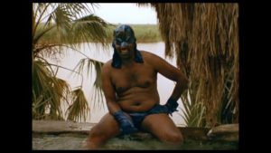 Batfro (Solomon Tashe) relaxes as he plots against his enemies in Miguel Llanso's Jesus Shows You the Way to the Highway (2019)