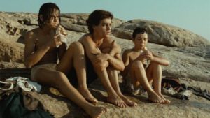 After escaping the reformatory, street kids relax by the sea in Hector Babenco's Pixote (1980)