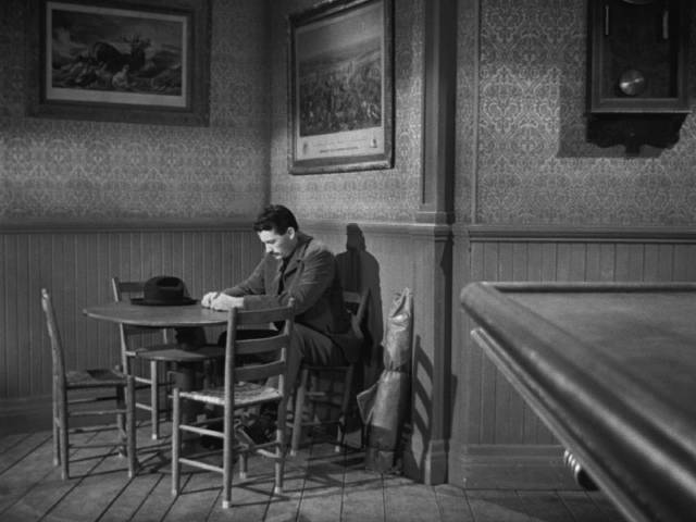 Jimmy Ringo (Gregory Peck) tries to blend into the background to avoid confrontations in Henry King's The Gunfighter (1950)