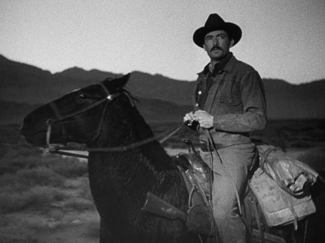 Weary, dressed in poorly fitting clothes, Jimmy Ringo (Gregory Peck) wants to leave his past behind in Henry King's The Gunfighter (1950)
