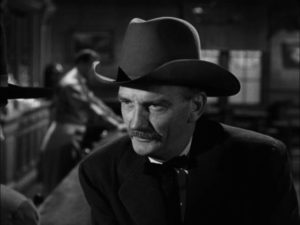 Old friend, now Marshal, Mark Strett (Millard Mitchell) wants Jimmy Ringo (Gregory Peck) to get out of town in Henry King's The Gunfighter (1950)