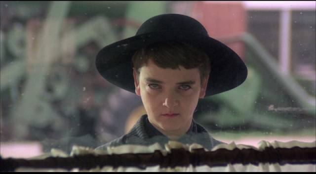 Diminutive cult leader Isaac (John Franklin) leads the slaughter of adults in Fritz Kiersch's Children of the Corn (1984)