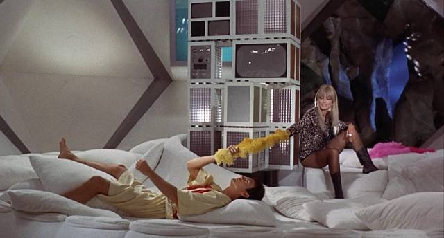 Diabolik (John Phillip Law) and Eva Kant (Marissa Mell) relax between crimes in Mario Bava's Danger: Diabolik (1968)