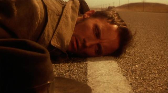The demon listens for the approach of a new victim in Richard Stanley's Dust Devil (1992)