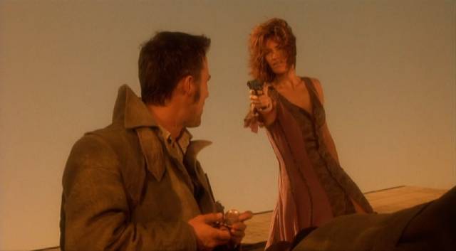 Wendy (Chelsea Field) doesn't want to give her life to the demon (Robert Burke) in Richard Stanley's Dust Devil (1992)