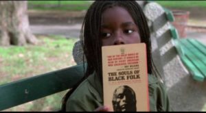 Pearline (Camille Winbush) talks books with Ghost Dog (Forest Whitaker) in the park in Jim Jarmusch's Ghost Dog: The Way of the Samurai (1999)