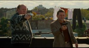 Ageing gangsters, irritated by their climb, are ready to shoot anybody they find on the roof in Jim Jarmusch's Ghost Dog: The Way of the Samurai (1999)