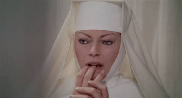 Sister Gertrude (Anita Ekberg) has doubts about her own sanity in Giullio Berruti's Killer Nun (1979)