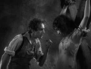 Dr. Mirakle (Bela Lugosi) performs unwholesome experiments on prostitutes in Robert Florey's Murders in the Rue Morgue (1932)