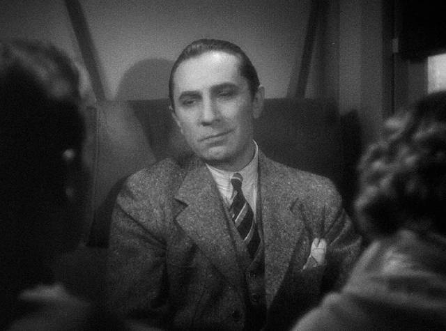 The melancholy Dr. Vitus Werdegast (Bela Lugosi) recounts his sad story to fellow travellers in Edgar G, Ulmer's The Black Cat (1934)