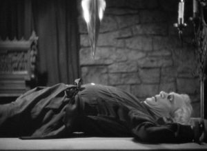 Judge Thatcher (Samuel S. Hinds) trapped under the pendulum in Richard Vollin (Bela Lugosi)'s basement in Lew Landers' The Raven (1935)