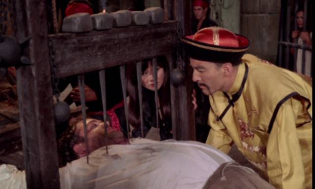 Fu Manchu (Christopher Lee) enjoys a torture break in Jess Franco's The Blood of Fu Manchu (1968)