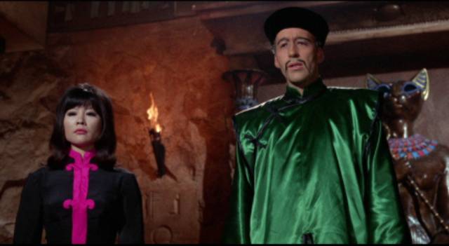 Fun Manchu (Christopher Lee) and Lin Tang (Tsai Chin) oversee big criminal schemes in Don Sharp's The Brides of Fu Manchu (1966)