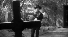 Gunslinger Drake Robey (Michael Pate) is at home in the graveyard in Edward Dein's Curse of the Undead (1959)