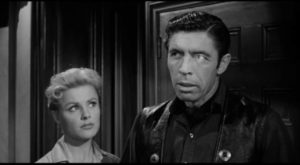 Dolores (Kathleen Crowley) hires gunslinger Drake Robey (Michael Pate) to protect her land in Edward Dein's Curse of the Undead (1959)