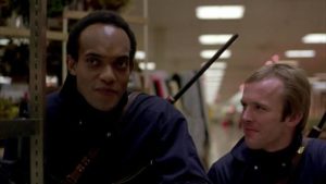 Peter (Ken Foree) and Roger (Scott H. Reiniger) realize what they have in a Mall of their own in George A. Romero's Dawn of the Dead (1978)