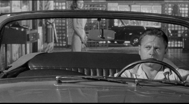 Eddie Shannon (Mickey Rooney) wonders what Barbara Mathews (Dianne Foster) is after in Richard Quine's Drive a Crooked Road (1954)