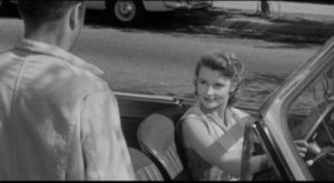 Barbara Mathews (Dianne Foster) seems to be pursuing Eddie Shannon (Mickey Rooney) in Richard Quine's Drive a Crooked Road (1954)