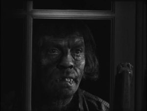 The titular face appears to signal imminent murder in George King's The Face in the Window (1939)