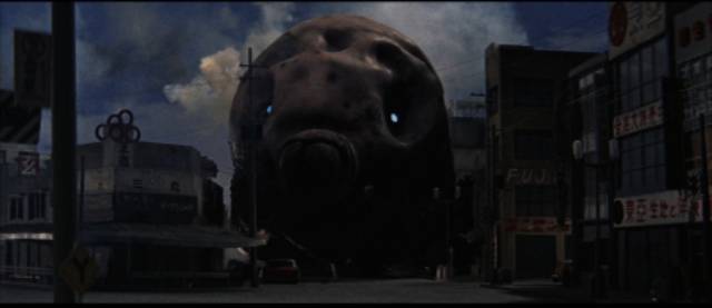 The giant larva arrives in Tokyo in Ishiro Honda's Mothra (1961)