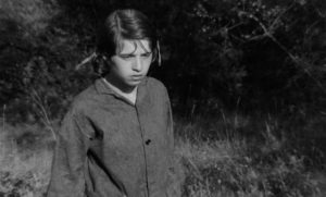 Mouchette (Nadine Nordier) watches a wounded animal die in Robert Bresson's Mouchette (1967)
