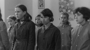 Mouchette (Nadine Nortier) doesn't fit in at school and is openly resentful in class in Robert Bresson's Mouchette (1967)