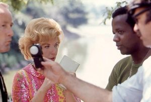 William Greaves works with the actors while the crew prepares a shot in Symbiopsychotaxiplasm: Take One (1968)