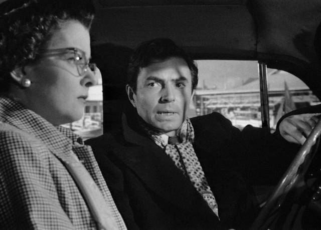 Donnelly (James Mason), a loan shark's henchman, shows up to blackmail Lucia (Joan Bennett) in Max Ophuls' The Reckless Moment (1949)